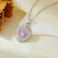Macro shot of silver necklace with pink heart gemstone and sparkling diamond halo - Silver Sunflower Triangle Pink Zircon Necklace (T021)