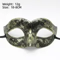 Vintage Roman warrior masquerade mask in antique gold with black filigree patterns - Little Beauty Gold
