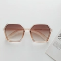 Polygon oversized sunglasses in light tea frame with gradient brown lenses and model detail - Champagne