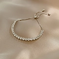Pulsera tenis plateada ajustable con circonitas cuadradas sobre seda champán - Nueva Pulsera De Plata Mfs175