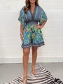 Detail of bohemian floral print V-neck jumpsuit with ruffled sleeves and elastic waist - S / Top And Bottom / Blue