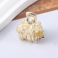 Detailed macro view of a golden poodle hair claw clip with pearls and translucent stones - 1# Pearl Set Small Claw Clip