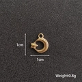 Macro shot of 1cm golden star moon pendant for DIY jewelry making with weight details - Moon & Star