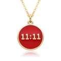 Macro shot of 18K gold plated pendant with red enamel and 11:11 numeric detail - Orange (B006)