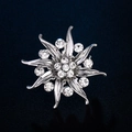 Elegant silver snowflake brooch with sparkling rhinestones on a deep blue texture - Silver Starburst Rhinestone Brooch (XD8431-2)