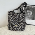 Fuzzy leopard print tote bag with plush material and branded gold metal plaque detail - Grey Leopard Print