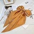 Elegant gold satin large bow hair clip with long ribbons on a vintage magazine base - Spring Clips / Orange