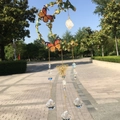 Detail of moon-shaped garden wind chime with green leaves, butterflies and crystal balls - Gold Green Leaf - Clear Quartz
