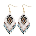 Bohemian multicolored seed bead woven tassel earrings with golden metal hooks on white background - Blue White Geometric (MG-E220041A)