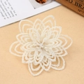 Detail of white glitter artificial Christmas flower with silver powder for tree decoration - White