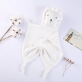 Detail of soft white cotton lion security blanket with knotted ends and lace trim for babies - White