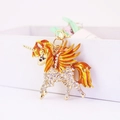 Unicorn keychain with white rhinestones and orange gradient enamel wings accessory - Gold