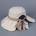 Detail of wide brim beige sun hat with back bow tie and embroidered brand logo - M (56-58cm) / Beige