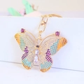 Portachiavi a farfalla dorata con ali in smalto colorato e strass brillanti - Viola