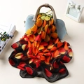 Lightweight chiffon scarf with warm orange polka dots draped on a blue handbag - Large Polka Dot Black Orange