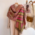 Detailed texture of ethnic floral pattern pashmina shawl with fringe hanging on coat - Small Floral - Green