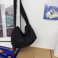 Black canvas crossbody hobo bag with adjustable strap for casual daily commuting - Black
