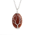 Detailed view of handmade tree of life wire-wrapped oval brown goldstone pendant necklace - Silver + Goldstone