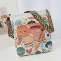 Ethnic embroidered canvas crossbody bag with vibrant elephant pattern and colorful strap - Orange Elephant