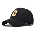 Close-up of the textured pineapple fabric and 3D embroidered C letter on a baseball cap - Adjustable / Black (Gold C Letter Embroidery)