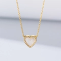 Detailed view of heart-shaped pearl shell necklace with sparkling zircon and gold chain - 925 Silver / Gold