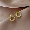 Elegant gold bow earrings with pearls and crystals on dark silk background - Wreath Bow Shape (A01)