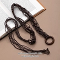Detailed close-up of dark brown woven belt with wooden beads and buckle on vintage book - Dark Coffee Woven Round Buckle Belt (X492-2)