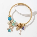 Golden woven bracelet with blue angel charms, crystal beads and heart key pendant - Blue