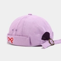 Detail of purple canvas docker hat featuring red bow embroidery and adjustable metal buckle - Light Purple