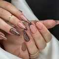 Long oval leopard print and nude French press-on nails shown on a model hand with gold rings - Bz1445 Dark Spots And Lip Lines / Jelly Glue + Nail File