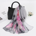 Elegant long georgette scarf with pink lotus print draped on a stylish black leather handbag - 160x50cm / Light Gray