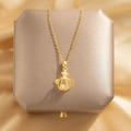 Elegant gold hollow planet pendant necklace with star detail and crystal on satin - Hollow Planet