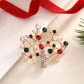 Christmas tree brooch in gold finish with colorful crystals on red festive background - BR0036-Gemstone Christmas Tree