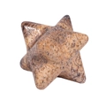 Macro shot of natural stone Merkaba star with smooth polished surface and brown spots - Jasper