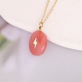 Macro shot of gold cross necklace with pink drop stone pendant and lightning pattern - Pink Oval Lightning (9#)