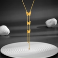 Golden titanium steel butterfly Y-necklace with matte finish and fringe pendant on gray background - Three Butterflies Necklace (D208)
