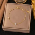 Gold stainless steel beaded bracelet with central pearl accent and adjustable chain link - Seed Bead Chain Bracelet / Gold