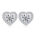 Sparkling zircon heart stud earrings in silver finish with halo setting and clear stones - White K Silver Heart Halo Stud Earrings (A-176)