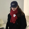 Thick red knitted winter scarf for women paired with a navy blue New York baseball cap - Christmas Red