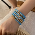 Stackable bohemian multi-layer beaded bracelet set with blue clay discs and gold accents - Blue