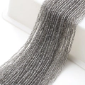 Macro shot of 2mm faceted grey glass beads for DIY necklaces and craft accessories - Smoke Gray