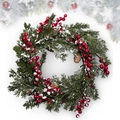 Artificial Christmas wreath with red berries, pine cones and faux snow on white background - 35cm PE Frost White Red Berry Wreath