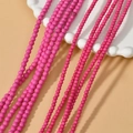 Macro shot of bright pink turquoise spacer beads on white wavy ceramic plate - 12# 4mm Rose Red (Approx 100pcs)