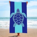 Close-up of quick-dry beach towel with blue sea turtle pattern on sunny coast - Dark Blue Geometric Turtle (STJ-019-010)