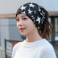 Versatile black knit neck gaiter with white stars for men and women, worn as a beanie - One Size / 10 Black White Stars