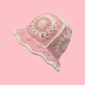 Close-up of pink and white handmade crochet bucket hat with bohemian granny square pattern - One Size / Five Flowers Pink