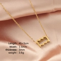 Golden zodiac necklace with geometric wave pendant on pink silk, 45+5cm length - Aquarius