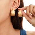 Chic 18k gold teardrop earrings with vertical stripe texture in a high-polished finish - Striped Teardrop Gold