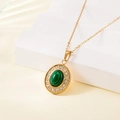 Gold stainless steel necklace with oval green malachite pendant and rhinestone border - Malachite Rhinestone Halo Style (137601)