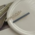Close-up of elegant acetate hair clips in blue and gold flakes on a ceramic tray - Grey Long 2pcs Set